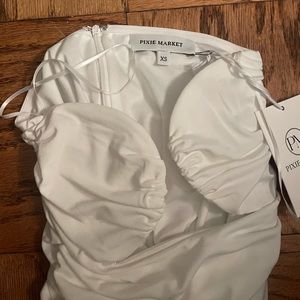 White bustier top with plunging neckline